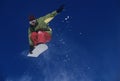 Snowboarder Jumping Against Blue Sky Royalty Free Stock Photo