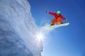 Snowboarder jumping against blue sky Royalty Free Stock Photo