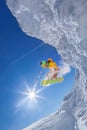 Snowboarder jumping against blue sky Royalty Free Stock Photo