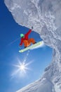 Snowboarder jumping against blue sky Royalty Free Stock Photo