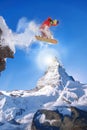 Snowboarder jumping against Matterhorn peak in Switzerland Royalty Free Stock Photo