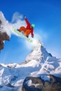 Snowboarder jumping against Matterhorn peak in Switzerland Royalty Free Stock Photo