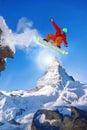 Snowboarder jumping against Matterhorn peak in Switzerland Royalty Free Stock Photo