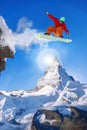 Snowboarder jumping against Matterhorn peak in Switzerland Royalty Free Stock Photo