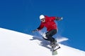 Snowboarder jumping through air with deep blue sky Royalty Free Stock Photo