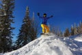 Snowboarder jumping through air with deep blue sky in background Royalty Free Stock Photo