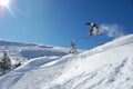 Snowboarder in action on a sunny winter day.