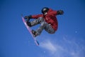 Snowboarder jumping high