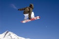 Snowboarder jumping high in the air