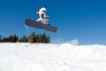 Snowboarder jumping from snow kicker Royalty Free Stock Photo