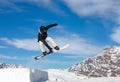 Snowboarder jumps in air