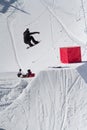 Snowboarder jumps in Snow Park, ski resort