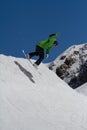 Snowboarder jumps in Snow Park, ski resort