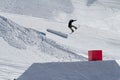 Snowboarder jumps in Snow Park, ski resort