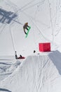 Snowboarder jumps in Snow Park, ski resort