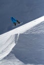 Snowboarder jumps in Snow Park, ski resort