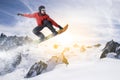 Snowboarder jumps on snowboard in a snowy winter landscape