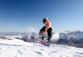 Snowboarder jumps up on the mountain