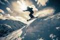 a snowboarder in mid - air on the slope