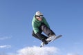 Snowboarder Performing Stunt Against Blue Sky Royalty Free Stock Photo