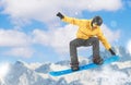 Snowboarder performing a tail grab Royalty Free Stock Photo