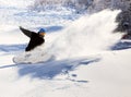 Snowboarder racing down