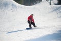 Snowboarder rides over fresh snow after jumping Royalty Free Stock Photo