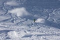 Snowboarder riding in powder