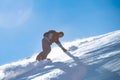 Snowboarder Riding Red Snowboard in Mountains at Sunny Day. Snowboarding and Winter Sports Royalty Free Stock Photo