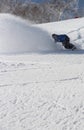 Snowboarder ripping into the fresh snow