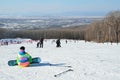 Arsenyev, Russia, January, 28, 2017. Snowboarder siting on the teaching slope. Ski resort in the town of Arsenyev
