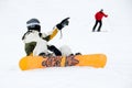 Snowboarder and skier