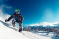 Snowboarder is sliding with snowboard