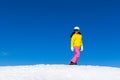 Snowboarder sliding woman down hill, snow Royalty Free Stock Photo