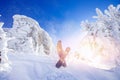 Snowboarder with snowboard background blue sky with sun light frozen rocks, Sheregesh ski resort. Concept extream Royalty Free Stock Photo