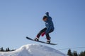 A snowboarder on a snowboard. Extreme winter sports.Rest in winter