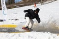 Snowboarder on a snowboard.Snowboarding down the mountain with overcoming