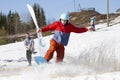 Snowboarder on a snowboard.Snowboarding down the mountain with overcoming