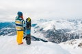 Snowboarder is standing with snowboard Royalty Free Stock Photo