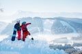 Snowboarders couple standing on top of the mountain Royalty Free Stock Photo