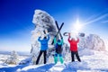 Snowboarders, skier stands with ski and snowboard in hands background blue sky with sun light. Concept freeride extreme