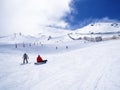 Snowboarders stopped in a snow piste