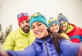 Snowboarders taking selfie