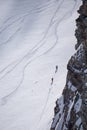 Snowboarders walking uphill for freeride