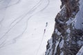 Snowboarders walking uphill for freeride