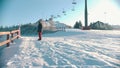 Snowboarding concept - An injured man with prosthetic leg skating down the mountain