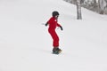 Snowboarding under the snow. Ski slope. White winter mountain