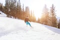 Snowboarding in winter Alps, man with fast speed on snowboard