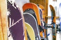 Snowboards, ski hanged on customized wooden wall mount at warehouse for seasonal storage,ski resort