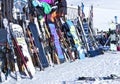 snowboards and skis leaning against apres ski restaurant in French Alps